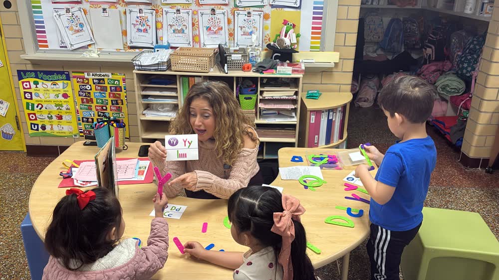 Pre-K teacher leading letter work with students
